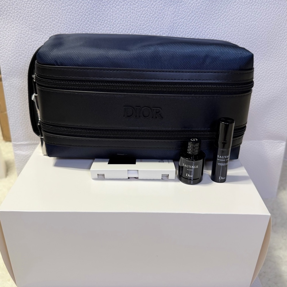 Dior navy blue toiletry bag for men; includes two perfume and cream samples.